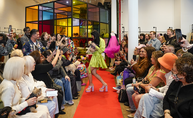 Host, Lara Eurdolian saluting Patricia Field on the runway with her senior rescue Charlie King for his 18th birthday, while audience, including Margaret Joseph, Laura Geller, Nicky Hilton Rothschild come out to support the senior rescue fashion show. Photo by Jennifer Graylock-Graylock.com