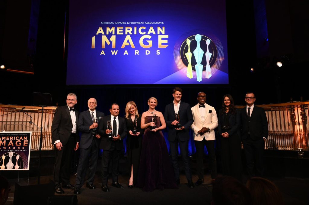 (L-R) Stephen Lamar, Allan Ellinger, Danilo Amoretty, Federica Marchionni, Lizanne Kindler, Wes Gordon, Segun Oduolowu, Gabrielle Ferrara, and Steven Kolb onstage during the 2024 AAFA American Image Awards at Gotham Hall. Photo credit Slaven Vlasic for Getty Images.